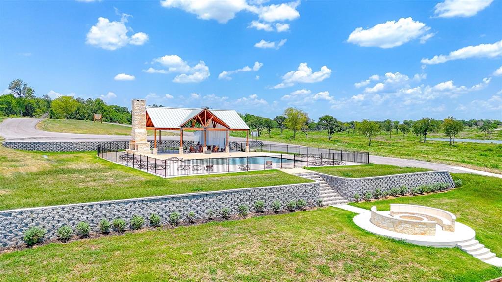 36 Chambers Bay Kerens, TX 75144 - Photo 19 of 22 a view of a playground with swimming pool and green space