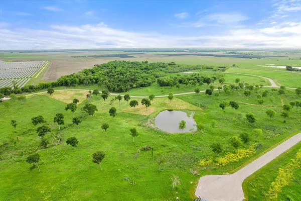 a view of a lake with a yard