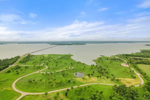 a view of a lake with a yard