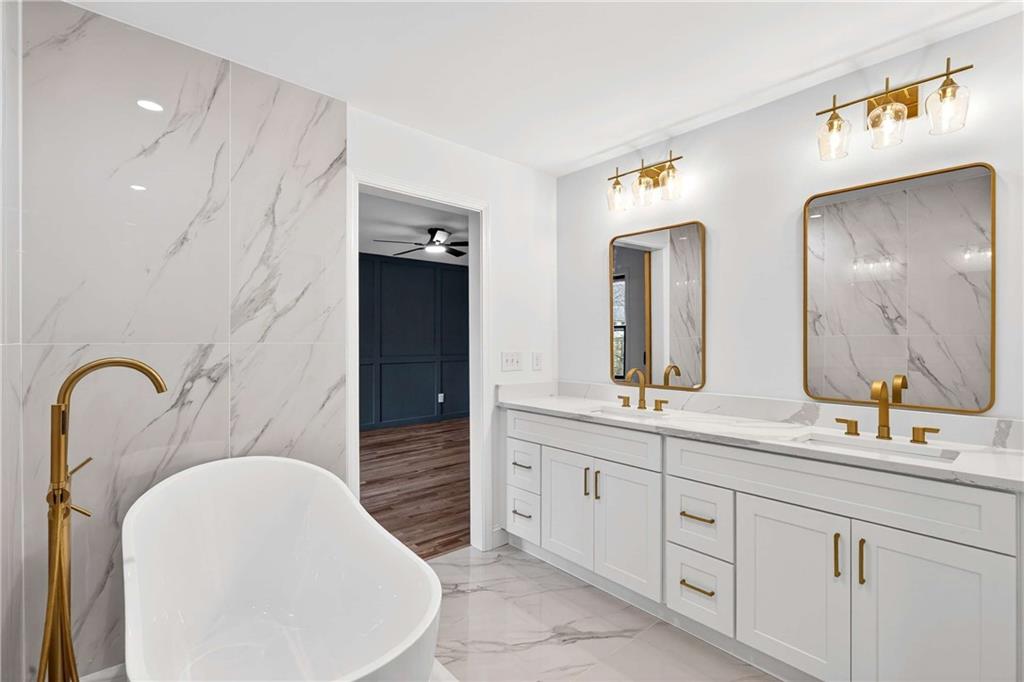 671 Willow Ridge Drive Northeast Marietta, GA 30068 - Photo 14 of 36 a bathroom with a double vanity sink and a mirror