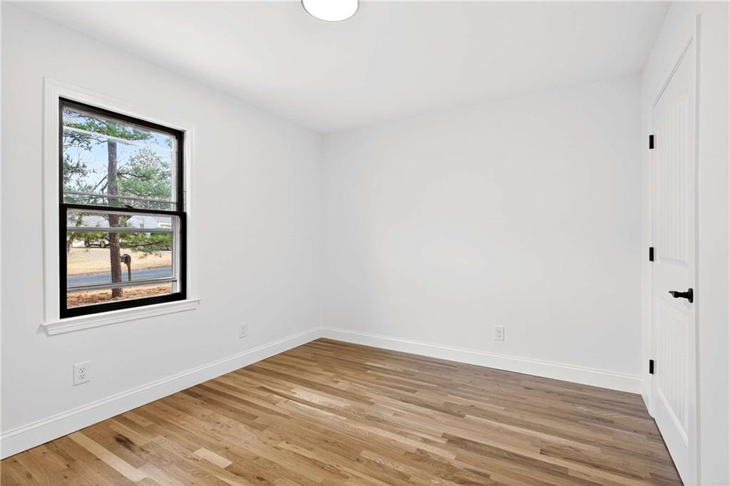 671 Willow Ridge Drive Northeast Marietta, GA 30068 - Photo 16 of 36 a view of a room with wooden floor and windows