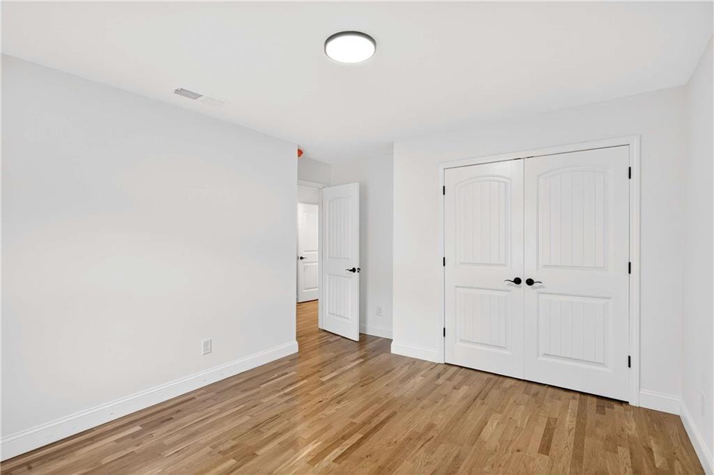 671 Willow Ridge Drive Northeast Marietta, GA 30068 - Photo 20 of 36 a view of an empty room with wooden floor