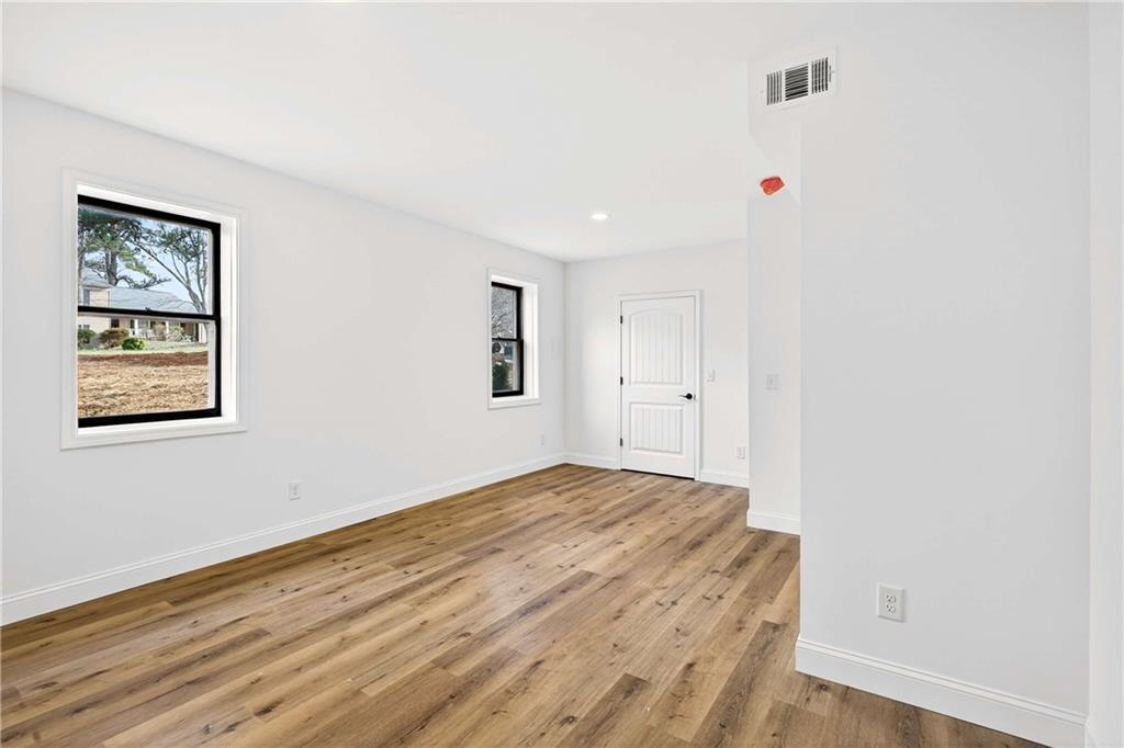 671 Willow Ridge Drive Northeast Marietta, GA 30068 - Photo 22 of 36 a view of livingroom with hardwood floor and window