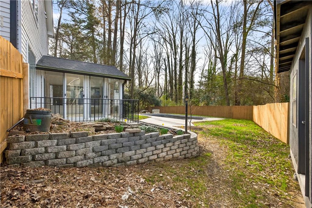 671 Willow Ridge Drive Northeast Marietta, GA 30068 - Photo 30 of 36 a view of a house with a small yard and wooden fence