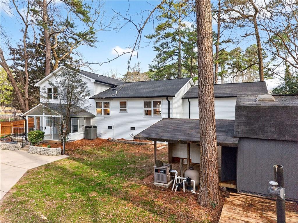 671 Willow Ridge Drive Northeast Marietta, GA 30068 - Photo 34 of 36 a view of a patio with a table and chairs under an umbrella