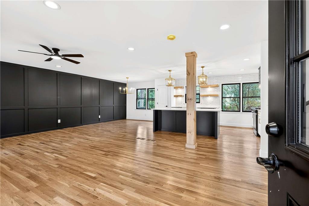 671 Willow Ridge Drive Northeast Marietta, GA 30068 - Photo 4 of 36 a large kitchen with kitchen island a sink appliances and a counter space