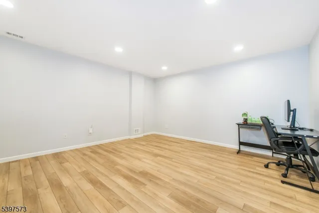 a view of work space with wooden floor