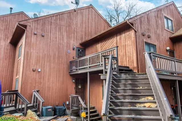 a view of a house with wooden stairs