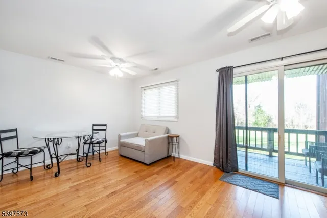 a bedroom with furniture and wooden floor