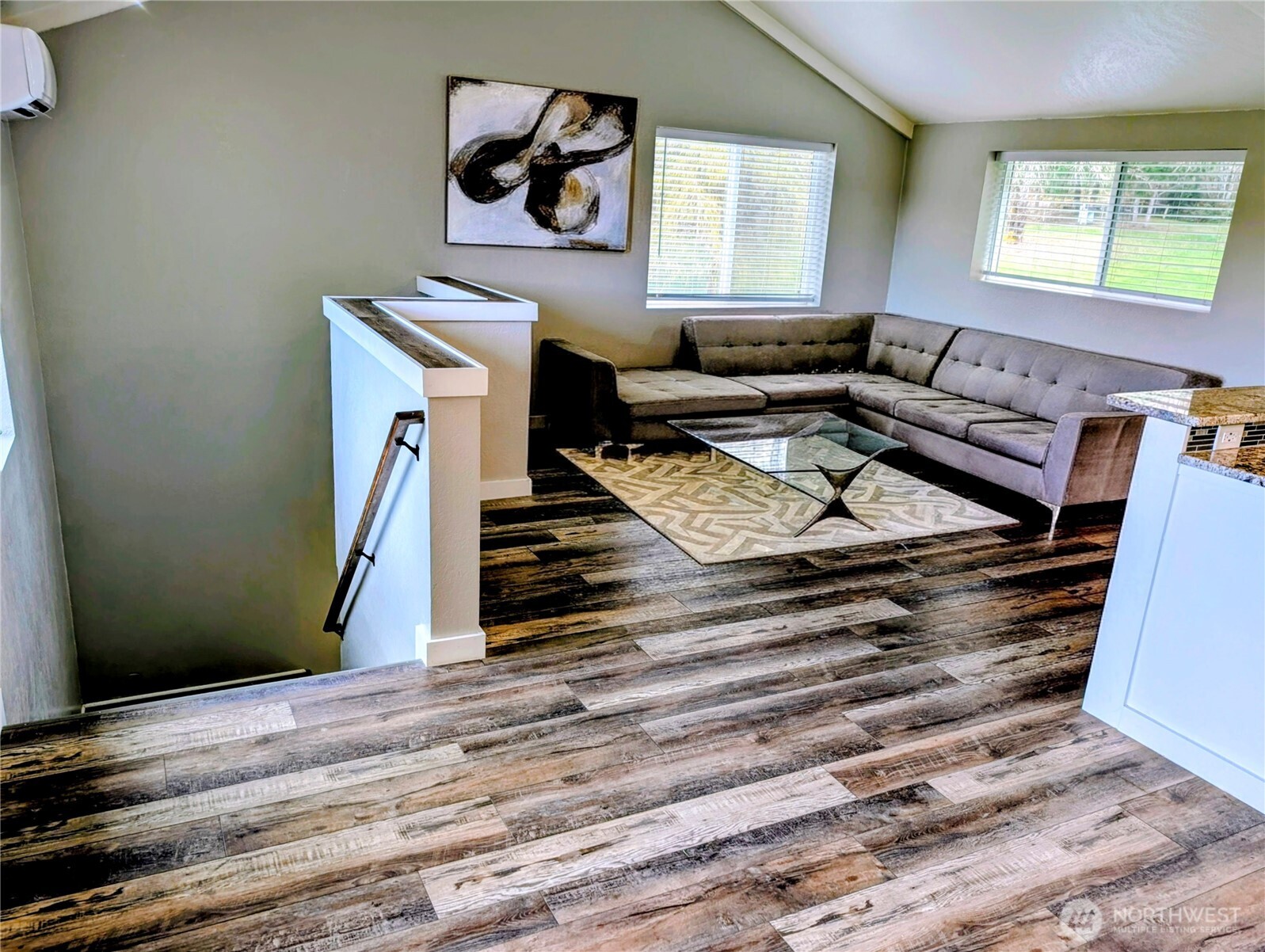 11108 Bliss Cochrane Road Northwest Gig Harbor, WA 98329 - Photo 11 of 39 a living room with stairs and a window