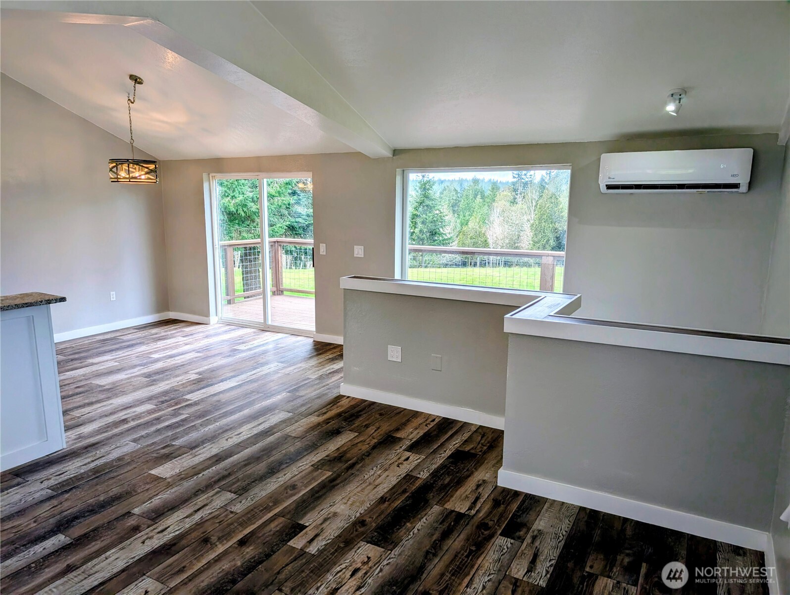 11108 Bliss Cochrane Road Northwest Gig Harbor, WA 98329 - Photo 14 of 39 a room with wooden floor and window