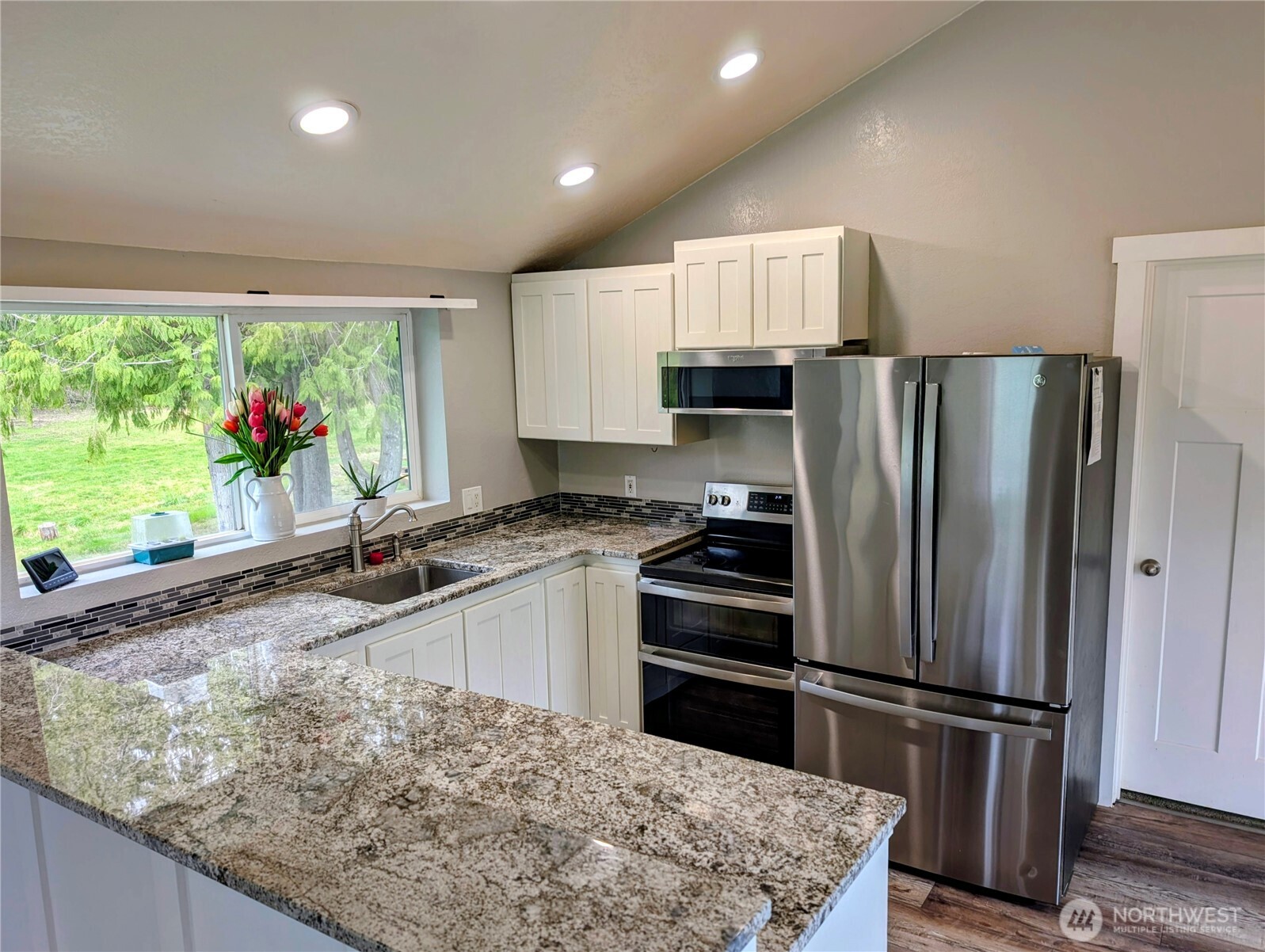 11108 Bliss Cochrane Road Northwest Gig Harbor, WA 98329 - Photo 15 of 39 a kitchen with refrigerator and window