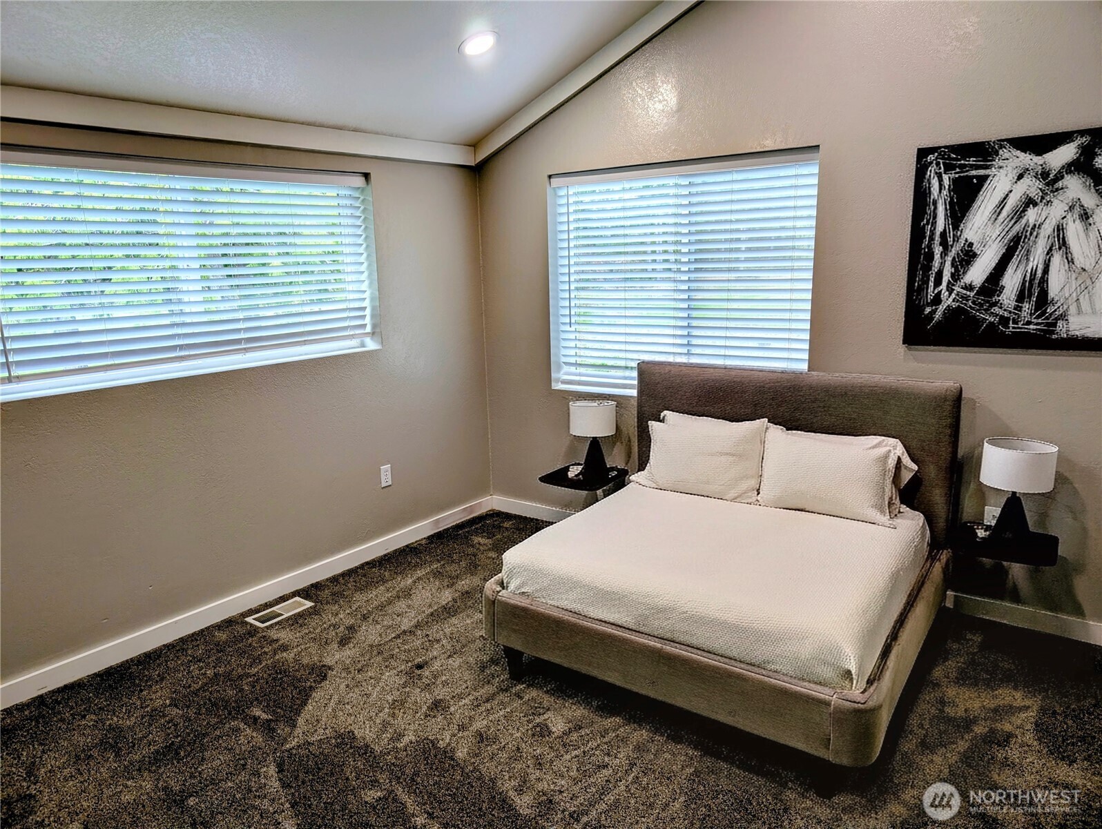 11108 Bliss Cochrane Road Northwest Gig Harbor, WA 98329 - Photo 18 of 39 a large bed sitting in a bedroom next to a window