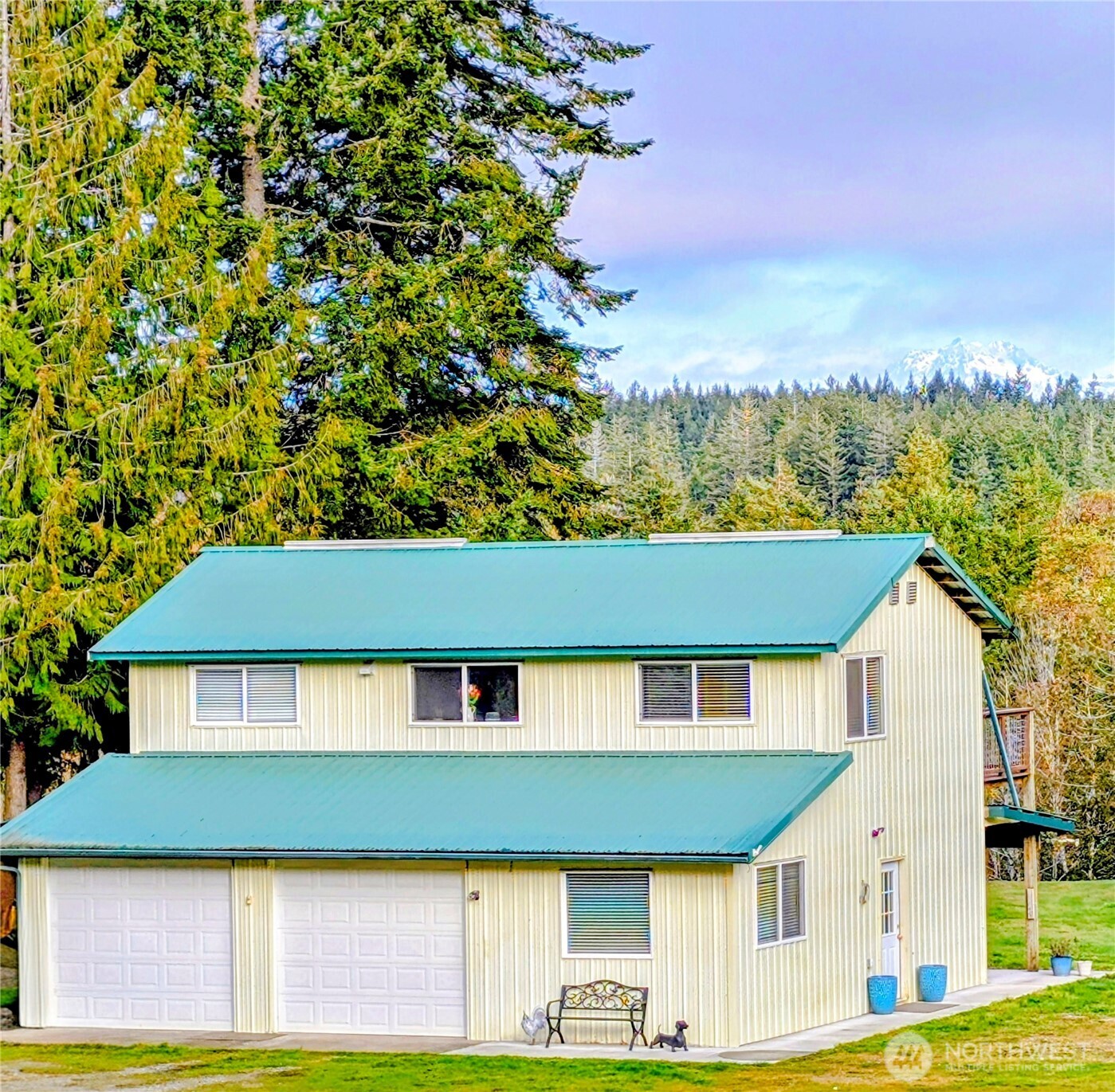 11108 Bliss Cochrane Road Northwest Gig Harbor, WA 98329 - Photo 2 of 39 a front view of a house with a yard