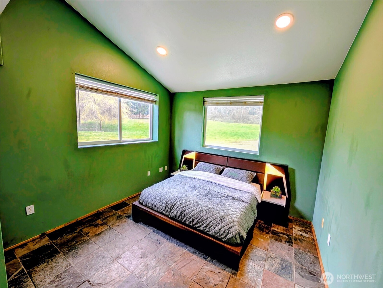 11108 Bliss Cochrane Road Northwest Gig Harbor, WA 98329 - Photo 22 of 39 a bed sitting in a room next to a window