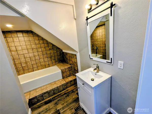a view of a hallway with wooden shelves