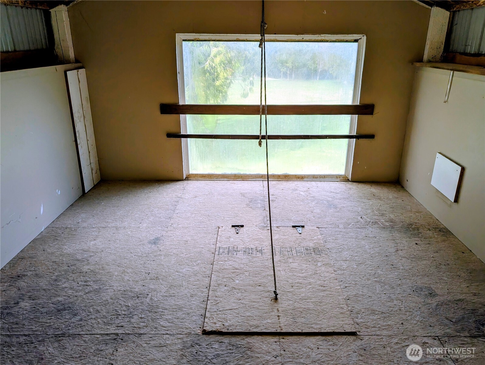 11108 Bliss Cochrane Road Northwest Gig Harbor, WA 98329 - Photo 31 of 39 a view of an empty room with a window