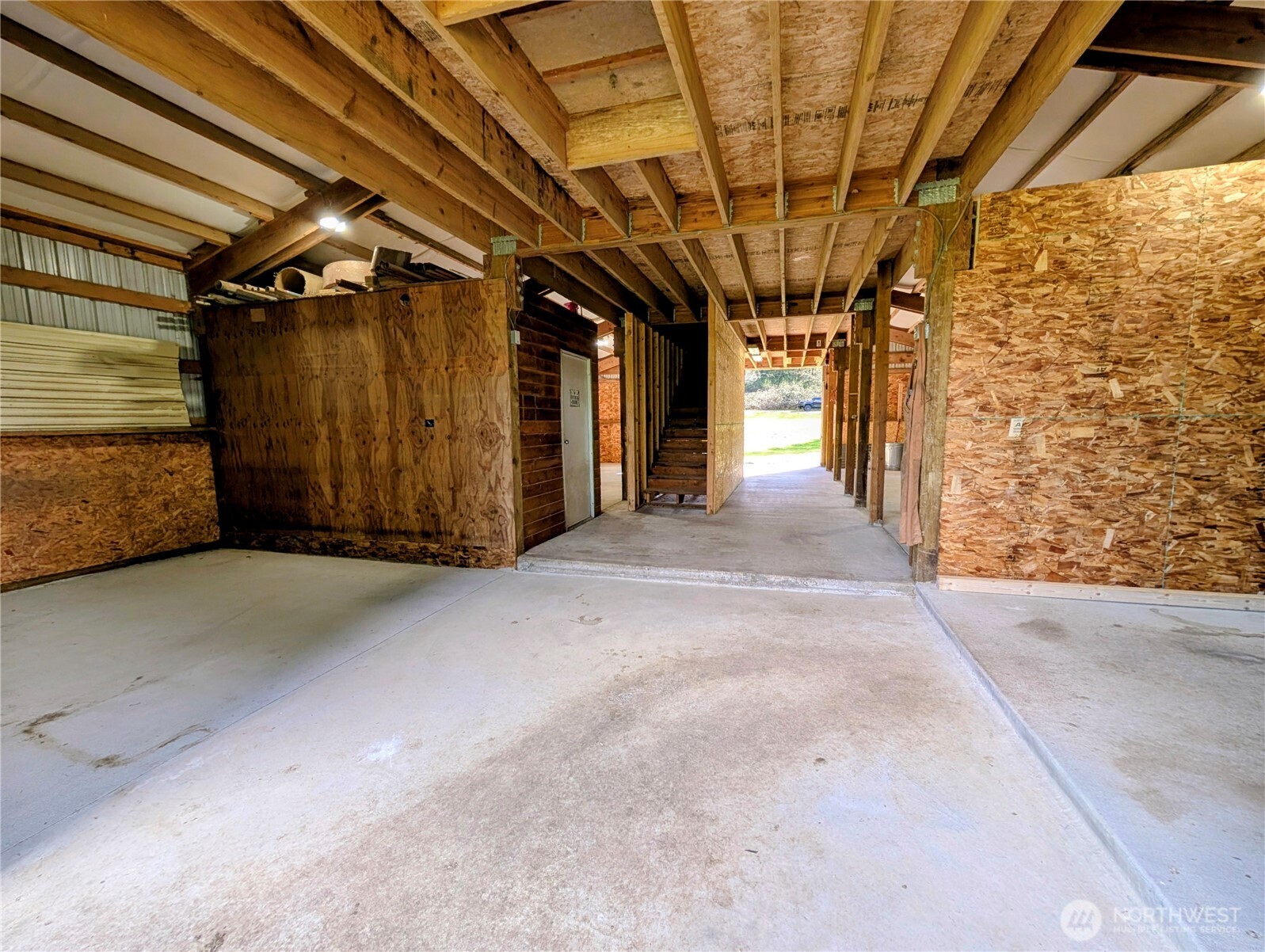 11108 Bliss Cochrane Road Northwest Gig Harbor, WA 98329 - Photo 34 of 39 a view of a hallway with a door