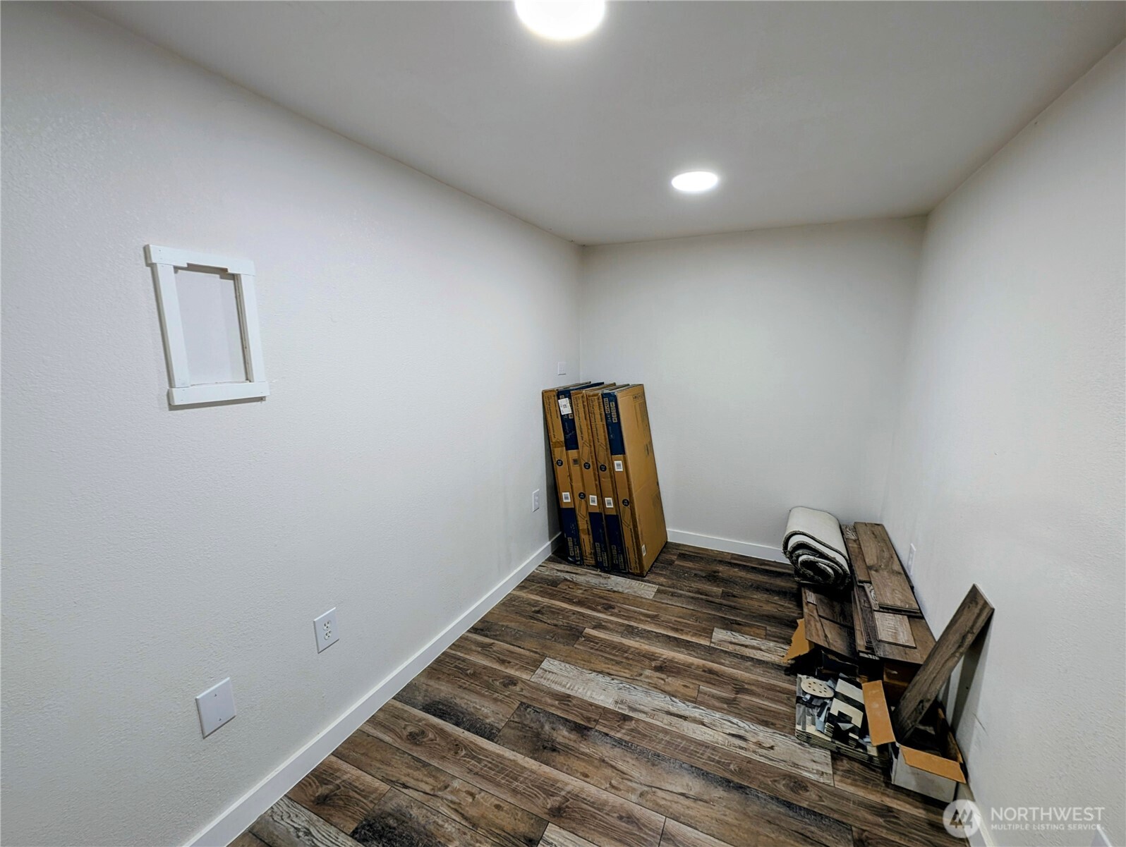 11108 Bliss Cochrane Road Northwest Gig Harbor, WA 98329 - Photo 35 of 39 a view of a room with wooden floor
