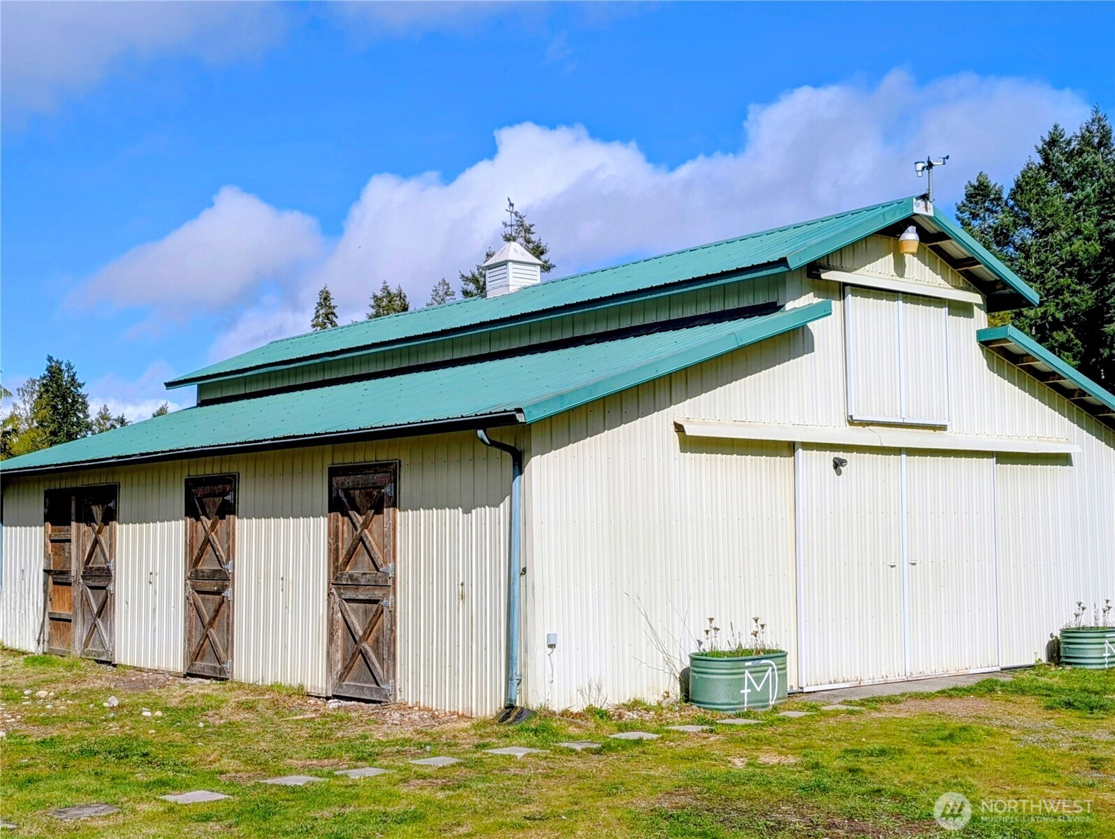 11108 Bliss Cochrane Road Northwest Gig Harbor, WA 98329 - Photo 6 of 39 a front view of a house with a yard