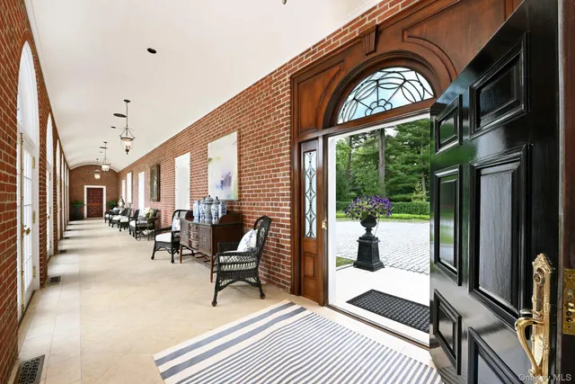 a view of an entryway with a front door