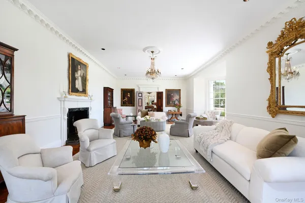 a view of a livingroom with furniture window and wooden floor