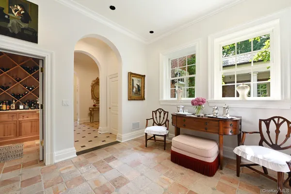a view of a house with potted plants