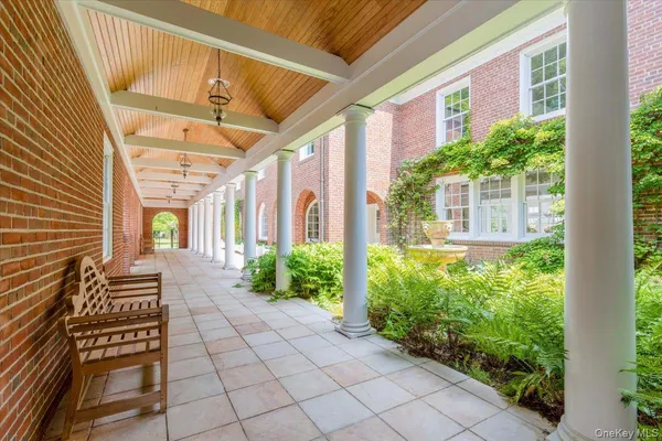 a bedroom with two beds and a large window