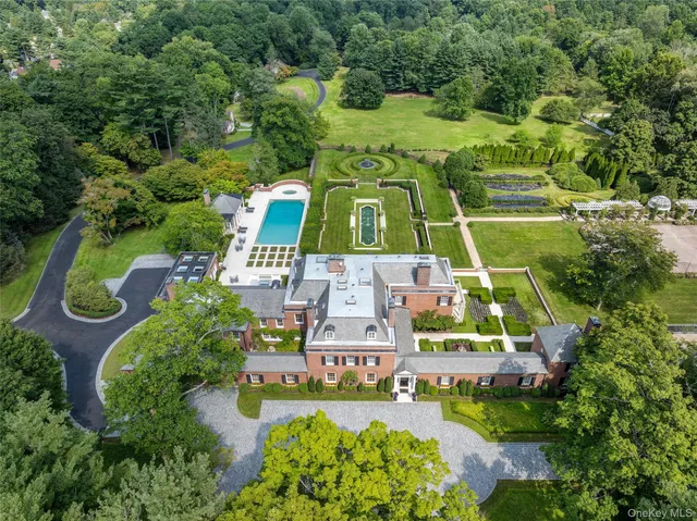 an aerial view of a house with a garden