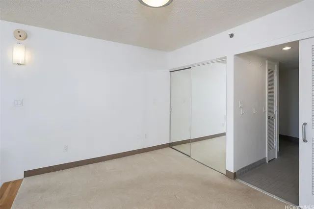 a bathroom with a toilet a sink a mirror and vanity
