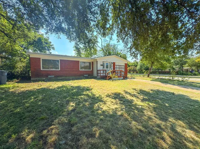 a house view with swimming pool in front of it