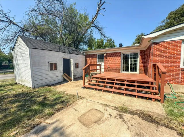 a view of a wooden deck with a bench