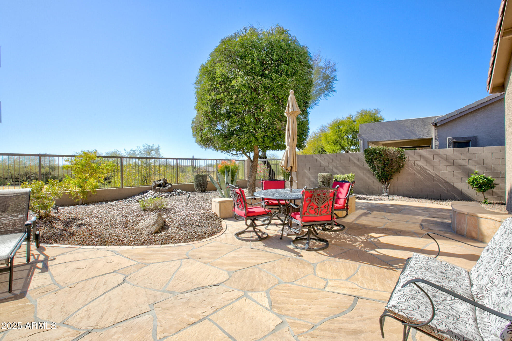 3055 North Red Mountain, Unit 156 Mesa, AZ 85207 - Photo 2 of 33 a view of backyard with swimming pool and seating space