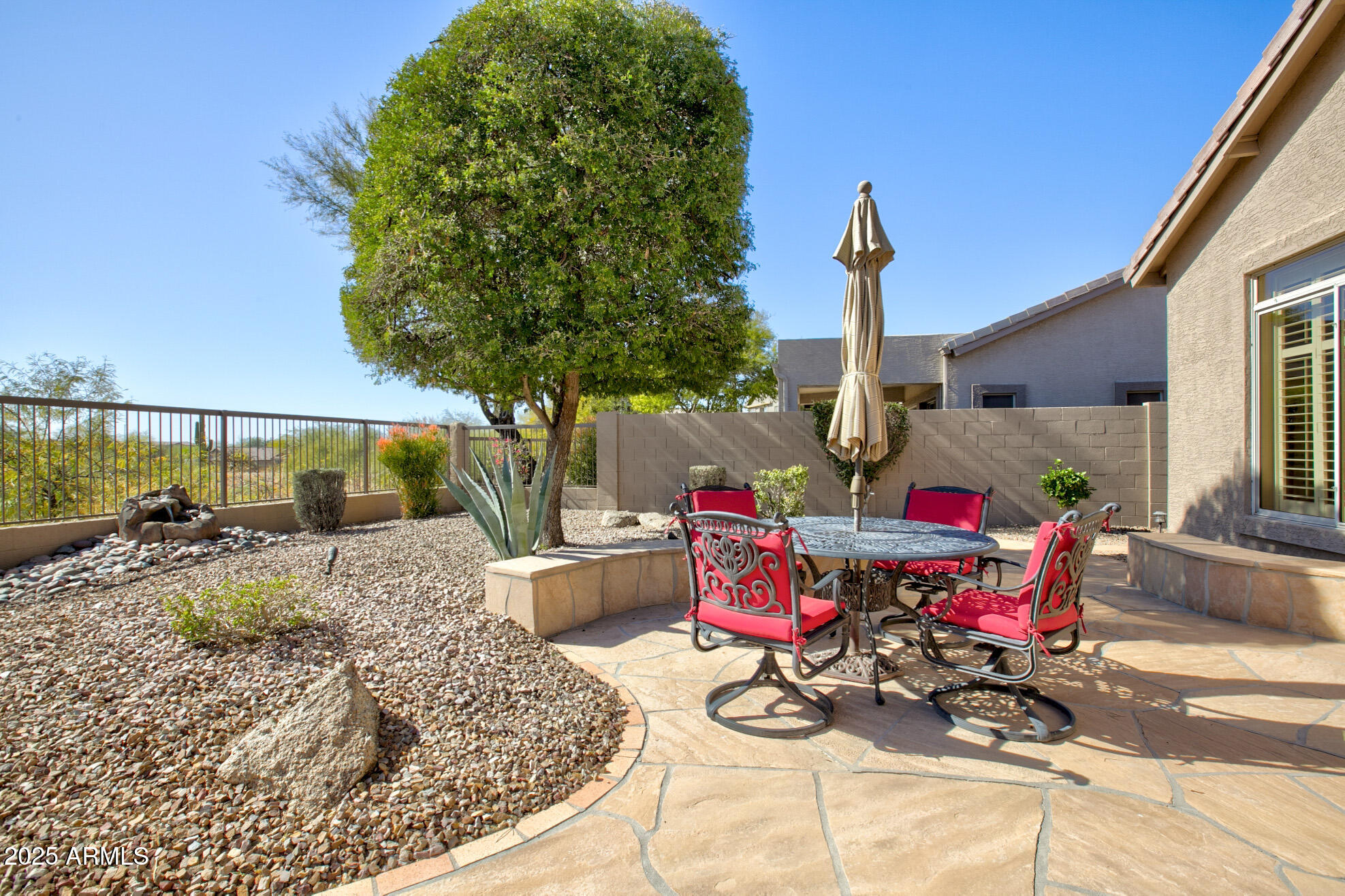 3055 North Red Mountain, Unit 156 Mesa, AZ 85207 - Photo 29 of 33 a view of a chairs and tables in patio