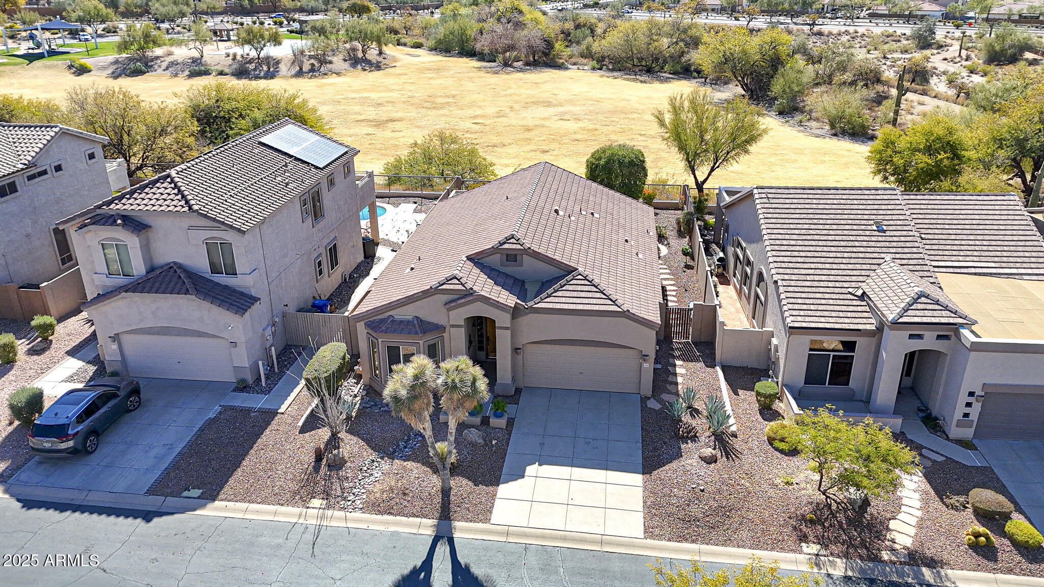 3055 North Red Mountain, Unit 156 Mesa, AZ 85207 - Photo 3 of 33 an aerial view of a house with garden space and lake view