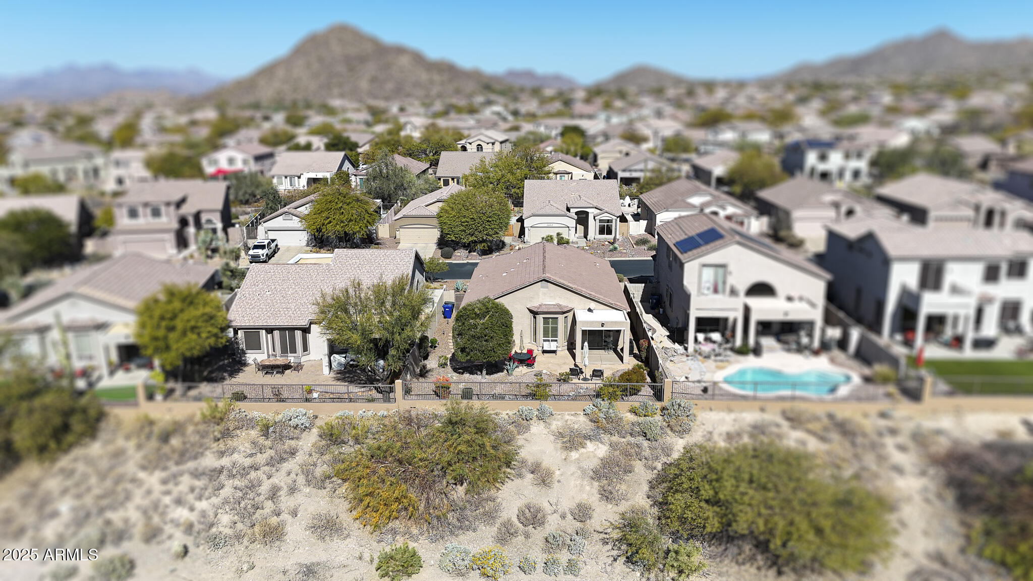 3055 North Red Mountain, Unit 156 Mesa, AZ 85207 - Photo 31 of 33 an aerial view of residential houses with outdoor space and trees