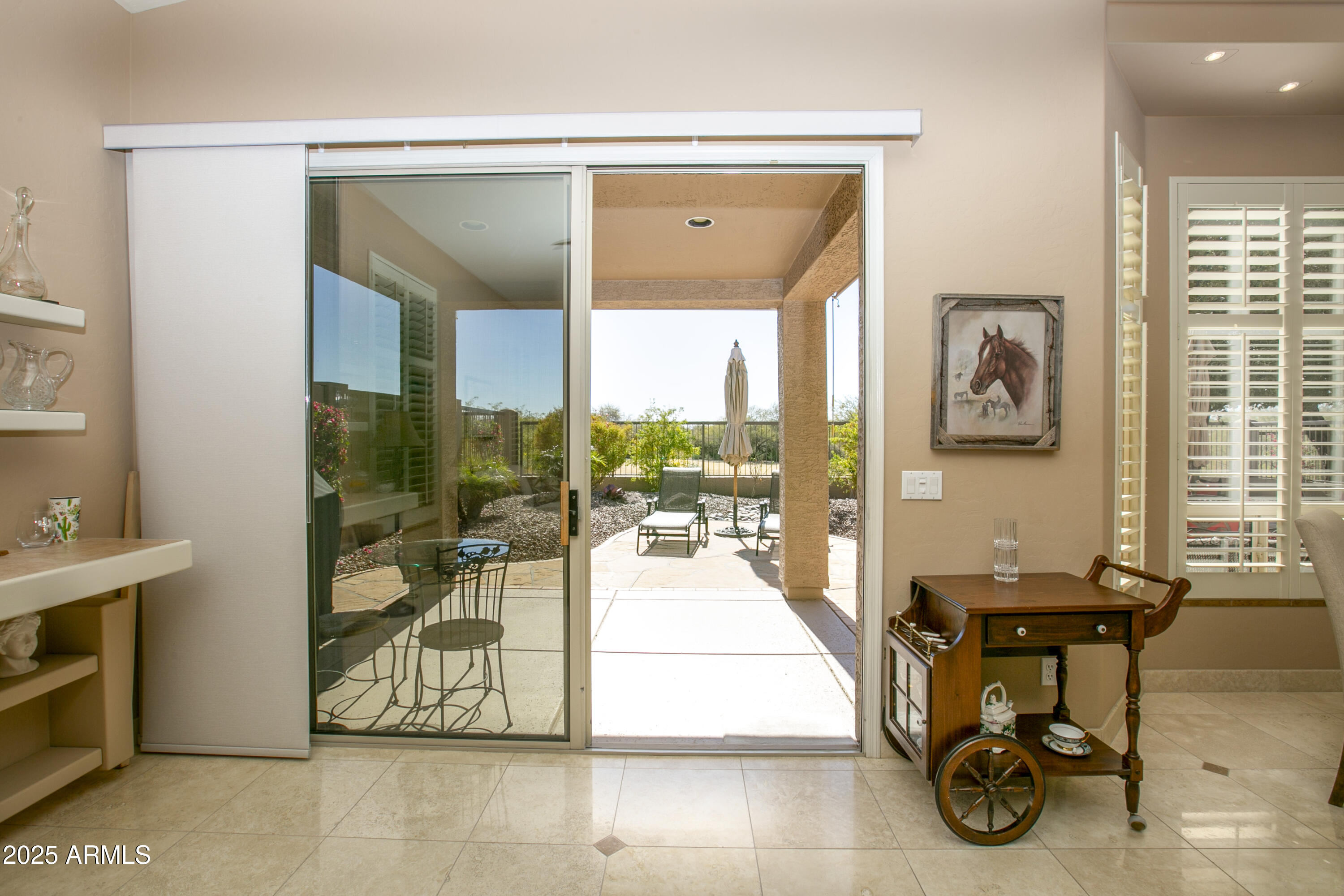 3055 North Red Mountain, Unit 156 Mesa, AZ 85207 - Photo 10 of 33 a view of a entryway with furniture and floor to ceiling window