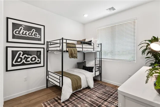 a bedroom with a bed and a table