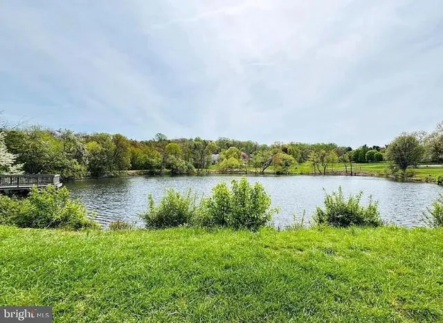 an aerial view of a house with yard swimming pool and outdoor seating