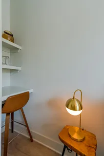 a view of a hallway with seating area