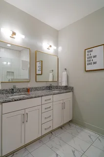 a bathroom with a shower and a sink