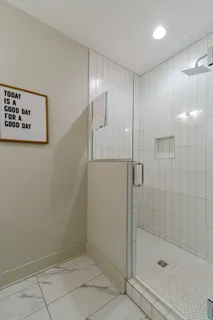 a living room with stainless steel appliances kitchen island granite countertop furniture and a flat screen tv