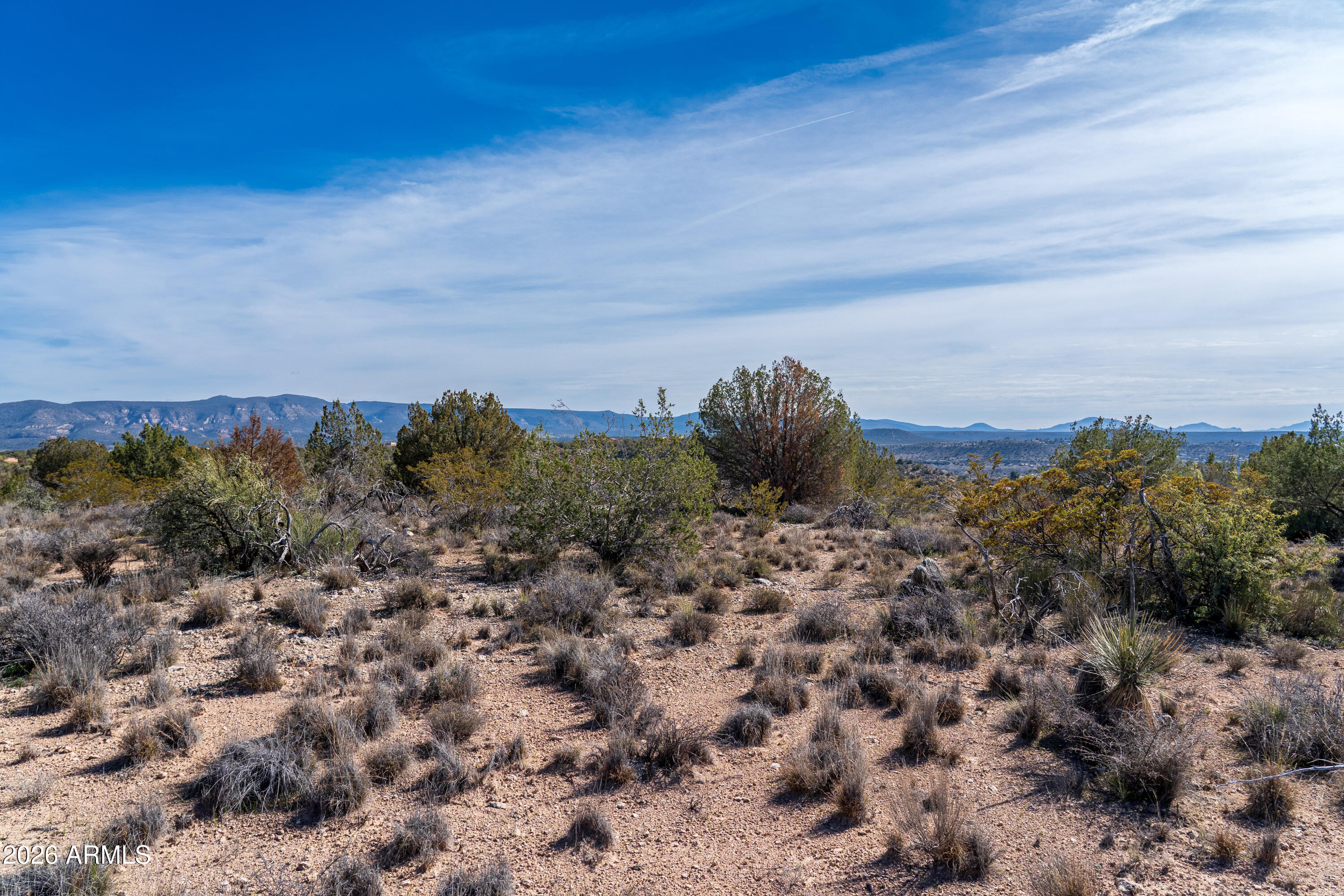 6740 North Canyon Road, Unit 141 Rimrock, AZ 86335 - Photo 9 of 12 a view of a dry yard with green space and fog