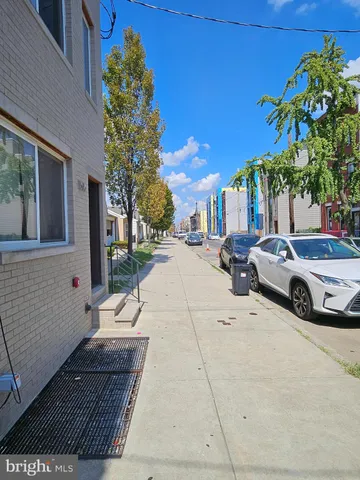 a view of a street with cars on road