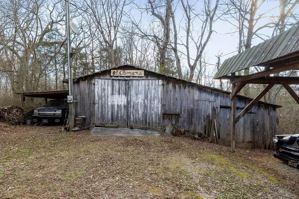 a view of backyard with barbeque and grill