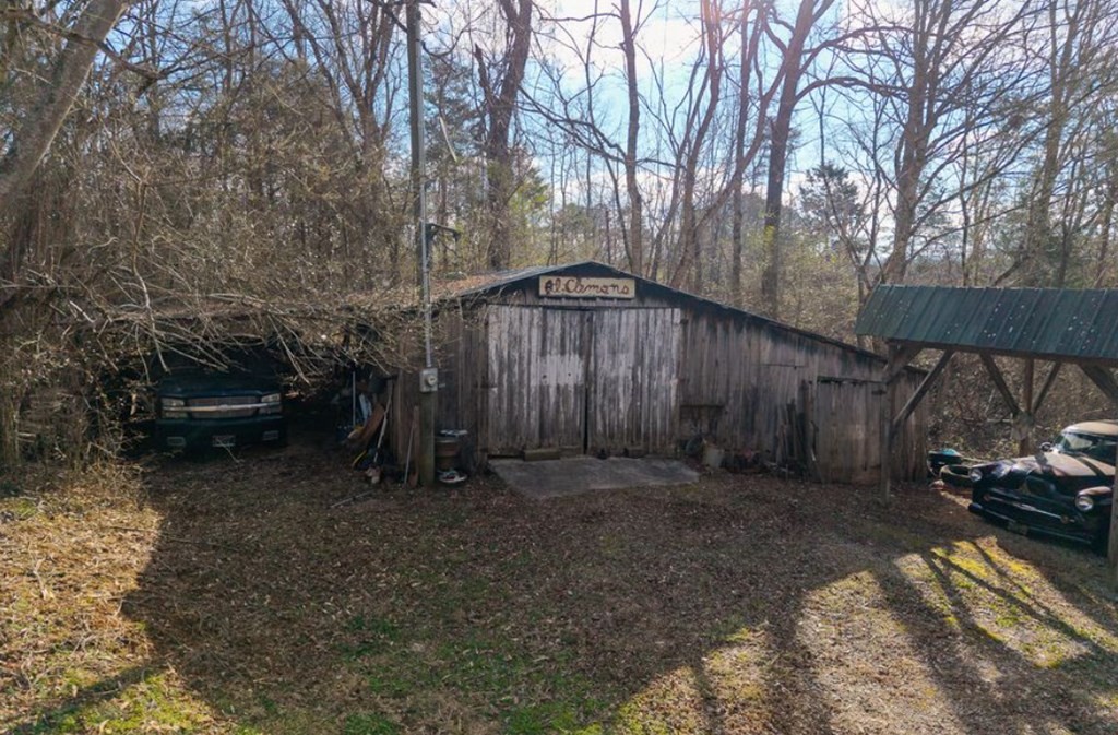 786 Quebeck Road Quebeck, TN 38579 - Photo 2 of 30 a backyard of a house with lots of green space and trees