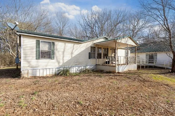 a house with trees in the background