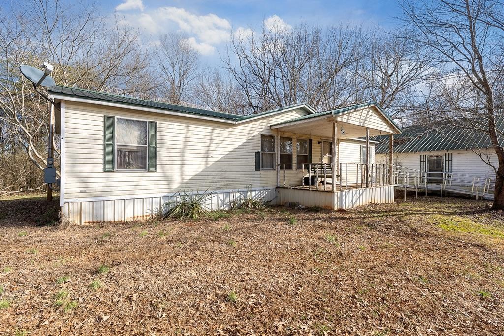 786 Quebeck Road Quebeck, TN 38579 - Photo 23 of 30 a house with trees in the background