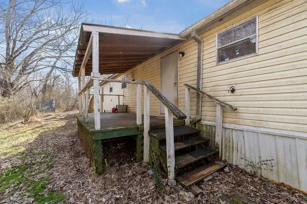 a view of entryway with wooden stairs
