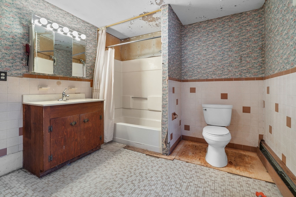 169 Nashua Road Pepperell, MA 01463 - Photo 11 of 31 a bathroom with a sink a toilet and shower